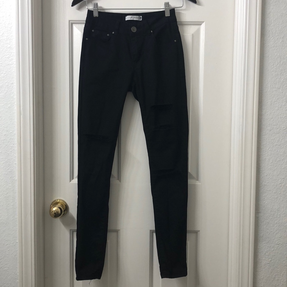 Black ripped jeans. Woman’s size 5. Skinny